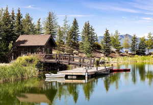 Dock area with a deck with water view