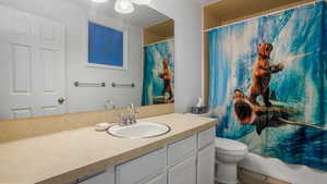 Full bathroom featuring vanity and toilet