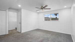 Unfurnished bedroom with a closet, carpet flooring, a ceiling fan, and recessed lighting