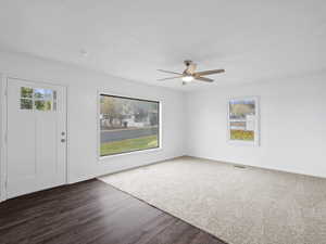 Entrance foyer with plenty of natural light, LVP floors, and a ceiling fan