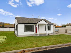 View of front of property with a shingled roof