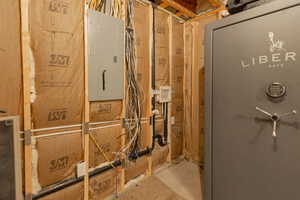 Bathroom with electric panel and a shower