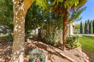 View of side of property with a lawn