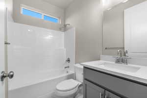 Bathroom featuring shower / bath combination and vanity
