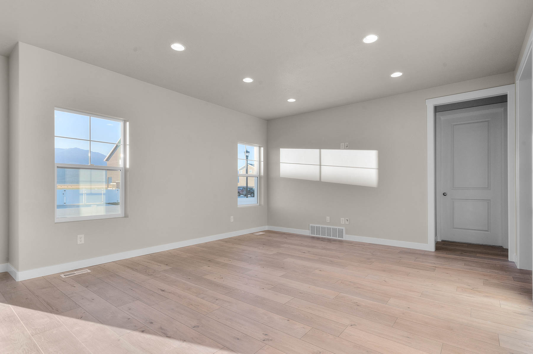 Empty room featuring recessed lighting and light wood-style floors