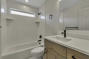 Bathroom featuring shower / washtub combination and vanity