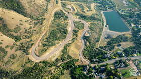 Aerial overview of property's location with a large body of water