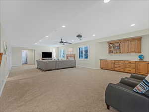 Family room with built-in cabinetry for storage