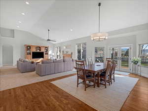 Dining area & great room w/ vaulted ceilings & 3 tone paint