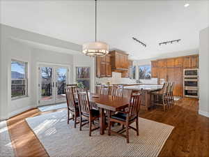 Dining space with french doors and high ceilings