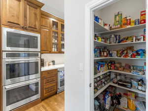 Pantry featuring beverage cooler