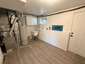 Utilities with gas water heater and heating unit