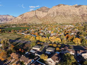 View of property location with a mountain backdrop and nearby suburban area