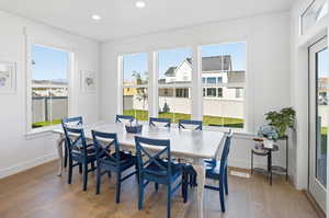Dining area featuring wood finished floors and recessed lighting