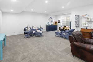 Living room featuring recessed lighting and carpet