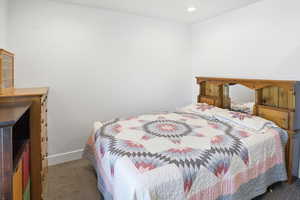 Bedroom with carpet flooring and recessed lighting