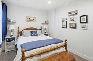 Bedroom with carpet floors and recessed lighting