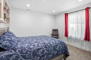 Bedroom featuring carpet and recessed lighting