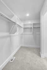 SPACIOUS PRIMARY SUITE WALK IN CLOSET!(PICTURE OF PREVIOUS BUILT HOME-COLORS AND MATERIALS MAY VARY)