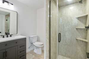 Bathroom with vanity and a shower stall