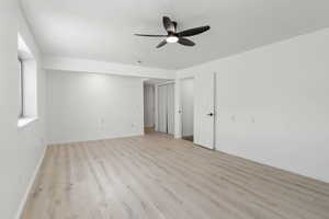 Unfurnished bedroom featuring light wood finished floors and ceiling fan