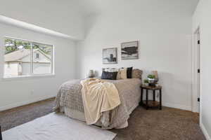 Carpeted bedroom with baseboards