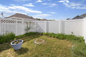 View of fenced backyard