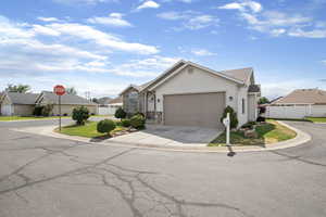 View of front of house with driveway and a garage