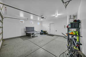 Garage featuring baseboards