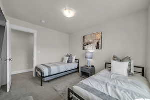 Carpeted bedroom with baseboards