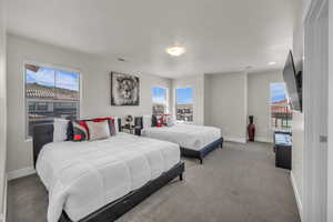 Carpeted bedroom with baseboards