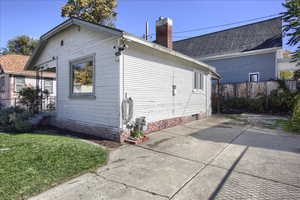 View of home's exterior featuring a chimney