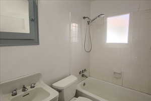 Bathroom with shower / tub combination and vanity