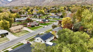 Aerial perspective of suburban area with a mountain backdrop