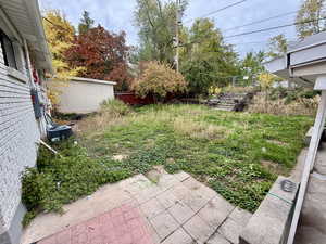 View of yard with a patio