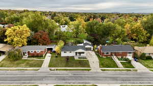 Aerial view of residential area with a heavily wooded area