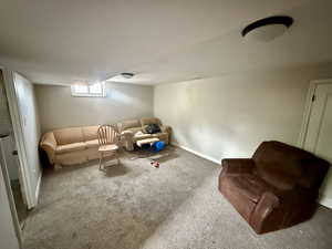 Living area with carpet floors and baseboards
