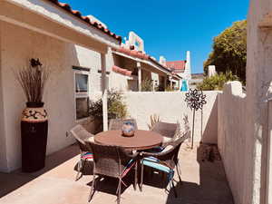 Fenced backyard featuring a patio area and outdoor dining space