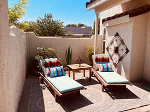 Fenced backyard with a patio area