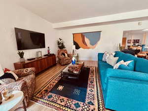 Living room with light wood finished floors and baseboards
