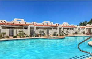 Community pool featuring a patio and a community hot tub