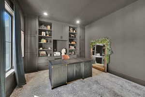 Office with recessed lighting, custom built ins and baseboards