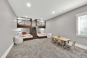 Recreation room that has walk in closet, could be used for bedroom, featuring carpet floors and recessed lighting