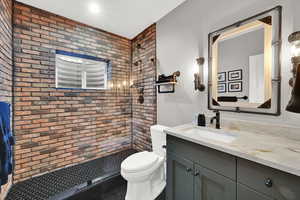 3/4 bathroom featuring vanity and a stall shower
