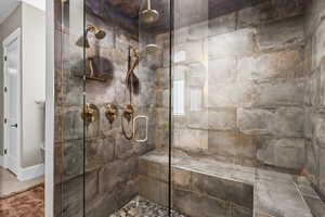 Bathroom featuring a shower stall