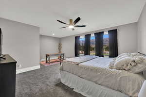 Bedroom with carpet and a ceiling fan