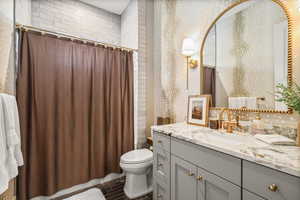 Full bath featuring vanity and shower / tub combo