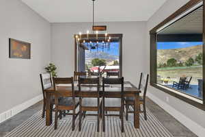 Dining area featuring a mountain view and a chandelier