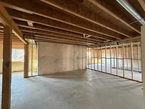 Miscellaneous room with plenty of natural light and concrete flooring