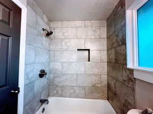 Full bathroom with shower / tub combination